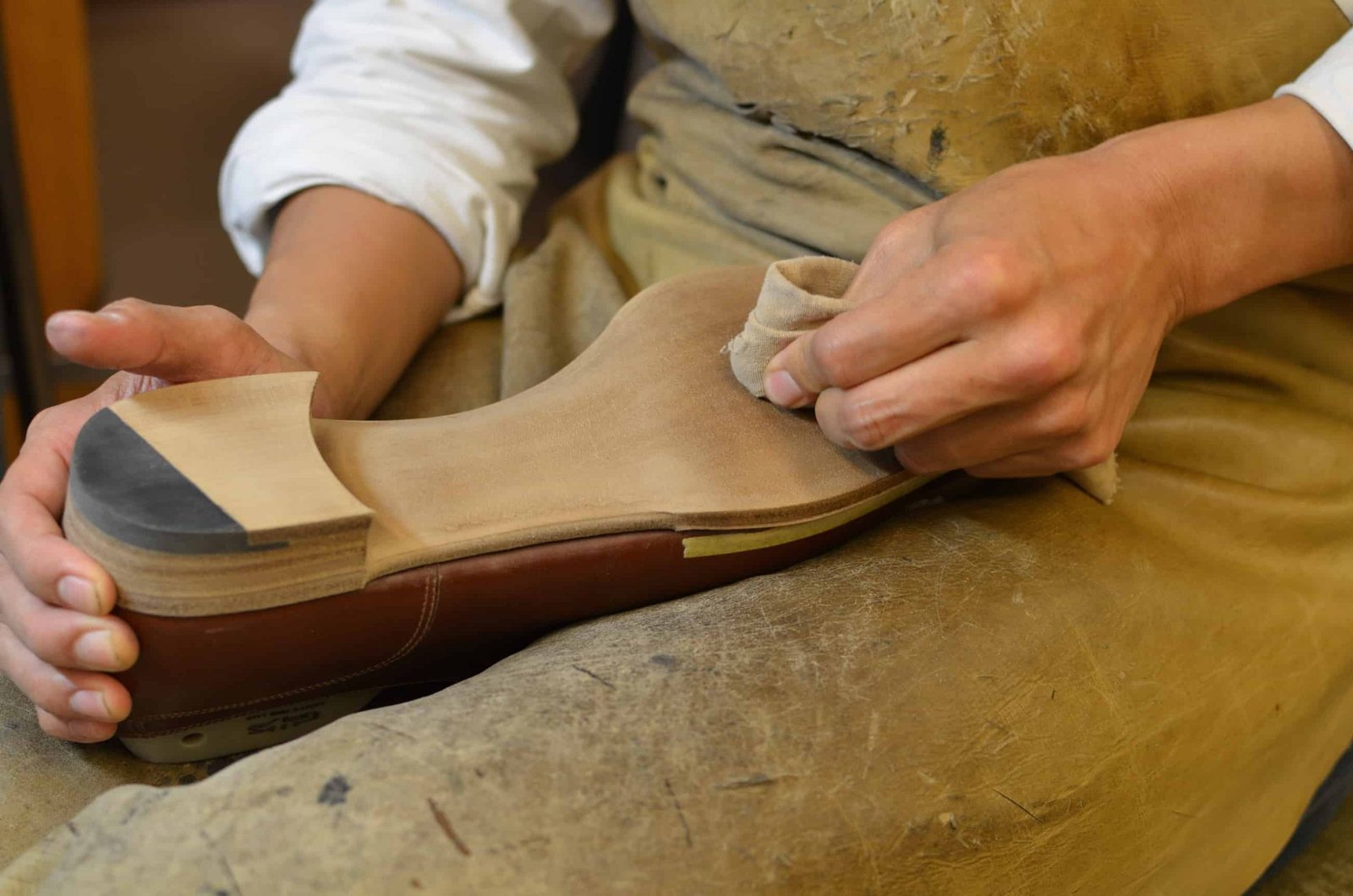 Cleaning the outsole, which is very important especially with a natural finish like the one being made for my shoes here.